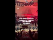Protesters light flares at Israeli Orchestra concert