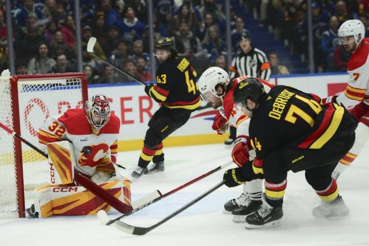 Deadspin | Flames score 5 consecutive goals to surge past Canucks
