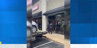 SUV crashes into T-Mobile store