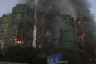 Four dead as fire rages through Hong Kong high-rise residential complex