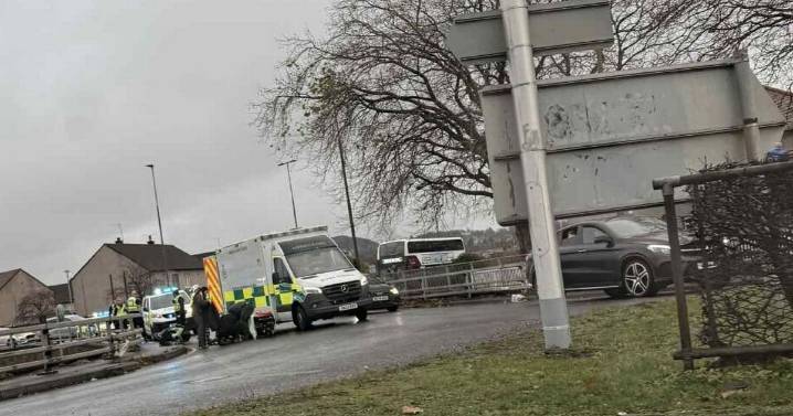 Busy Edinburgh road closed and motorcyclist hospitalised in crash at roundabout