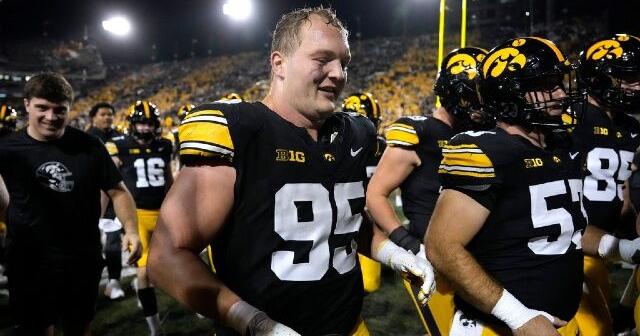 Iowa DT Aaron Graves with wife as son is born Thanksgiving, then he joins team for win at Nebraska