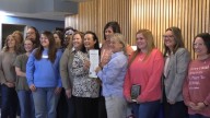 Adoption Awareness Month proclamation signed at the Family Enrichment Center