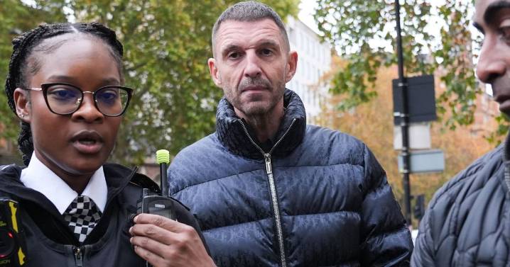 Tim Westwood appears at court in £2.4k coat as he's charged with four counts of rape