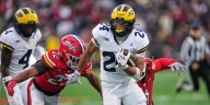 Substitute RB Kuzdzal runs for 100 yards and 3 TDs to lift No. 18 Michigan over Maryland 45