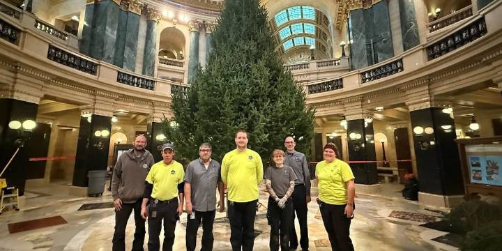Capitol crews raise Oconto County Christmas tree in rotunda