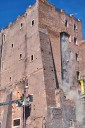 Rescuers work to reach worker trapped in medieval tower that partially collapsed in Rome