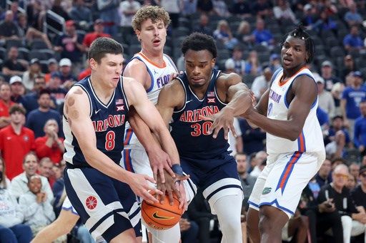 Freshman Koa Peat leads No. 13 Arizona to 93-87 win over defending champion, No. 3 Florida
