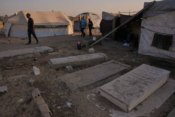 In Gaza cemeteries, some displaced Palestinians live among the dead
