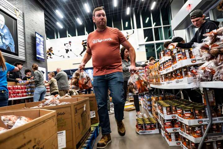 Packing meal boxes underscores the meaning of Thanksgiving
