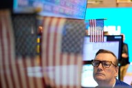 Wall Street holds steady as earnings reports flow in