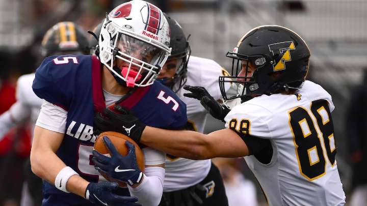 Liberty football battles way into D-11 semifinals with repeat win over rival Freedom