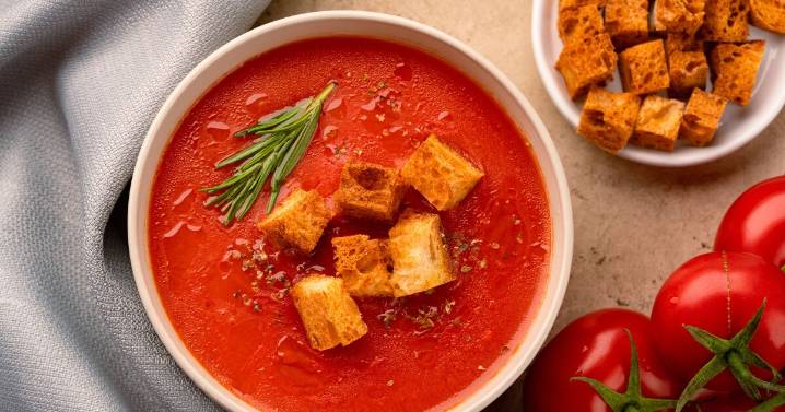 Tomato soup will be less acidic when you add 1 item at cooking stage