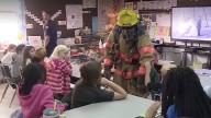 Third graders praised for spotting house fire, helping save dog