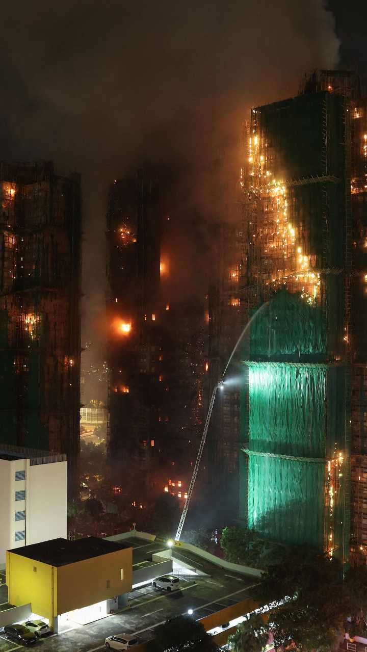Massive fire burns at Hong Kong residential complex
