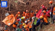 At least 18 people killed in Indonesian landslides as rescue efforts continue to find more than 30 others missing