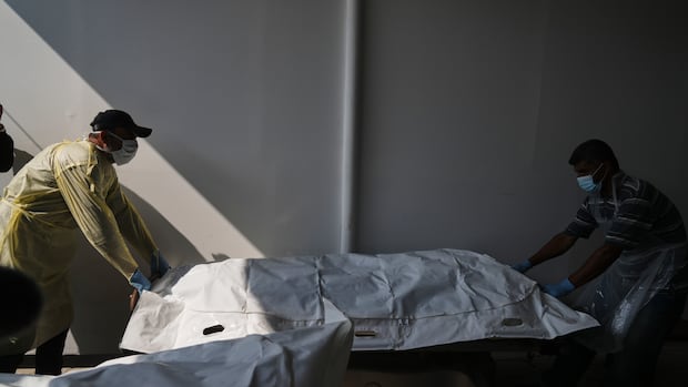 Israeli fire kills 3 people in Gaza, medics say, as hospital receives more Palestinian bodies