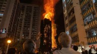 More than a dozen dead as fire rips through Hong Kong tower blocks