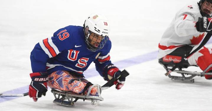 Paralympian Malik Jones lets the tape come off