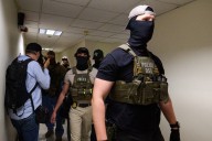 Trump sues California over law that bans masked federal agents