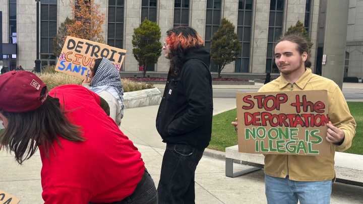 Anti-Trump protesters gather in Detroit to demand change from national, local politicians