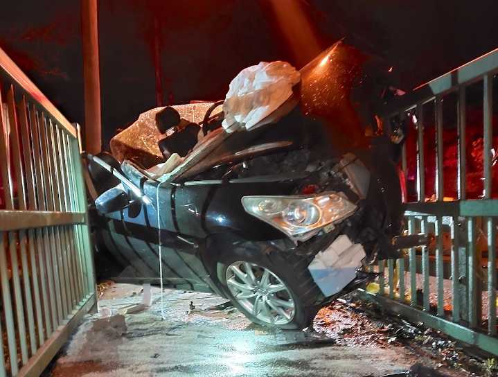 Drunk driver crashed into bridge, leaving car partly suspended in the air, police say