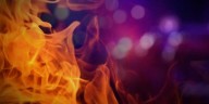 Man arrested on arson, other charges after home catches fire