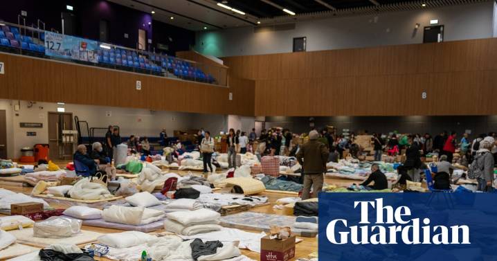 ‘There should have been an alarm’: in air thick with acrid smoke, people in Hong Kong are reeling and angry