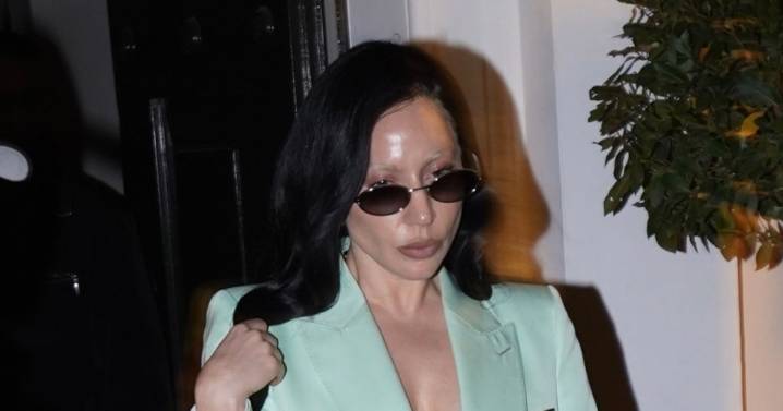 Lady Gaga Pairs No-Shirt Suit With Sheer Bra and Hermès Bag in Paris