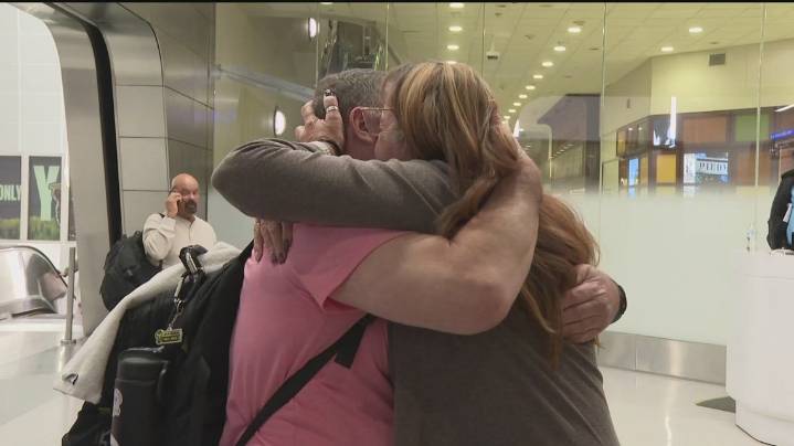 Families emotionally reunite at Atlanta airport after being stuck in Jamaica during hurricane