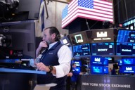 US stocks edge higher and approach another record