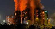 Hong Kong fire deaths rise to 55 as hundreds flee apartment blocks