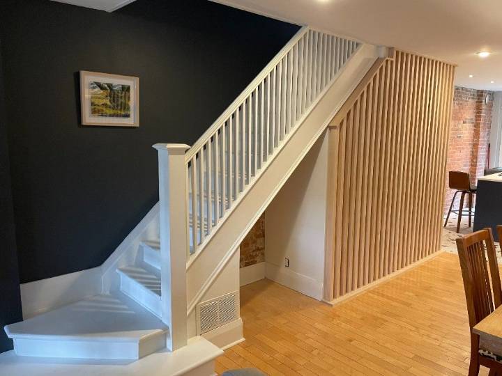 A nook under the stairs becomes a clever beverage station 