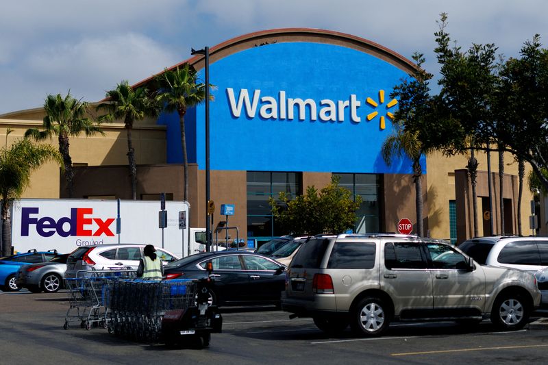 Walmart boosts outlook again, plans move to Nasdaq