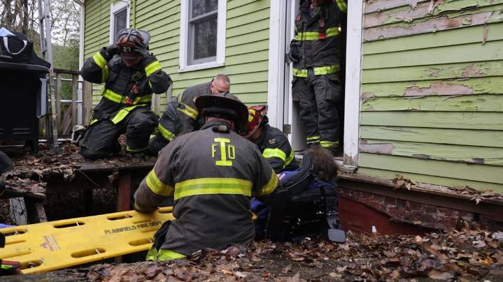 Indianapolis Fire Department crew rescues wheelchair users from collapsed deck