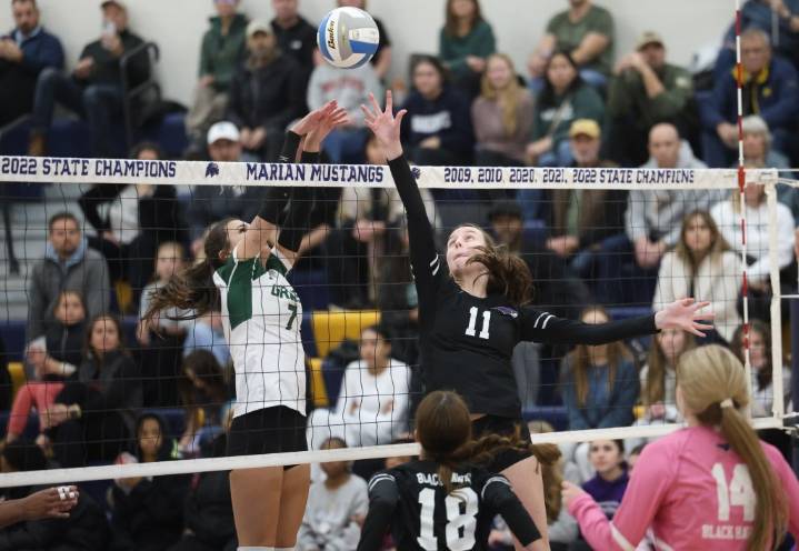 Photos of Bloomfield Hills vs. Birmingham Groves in a D1 volleyball regional championship