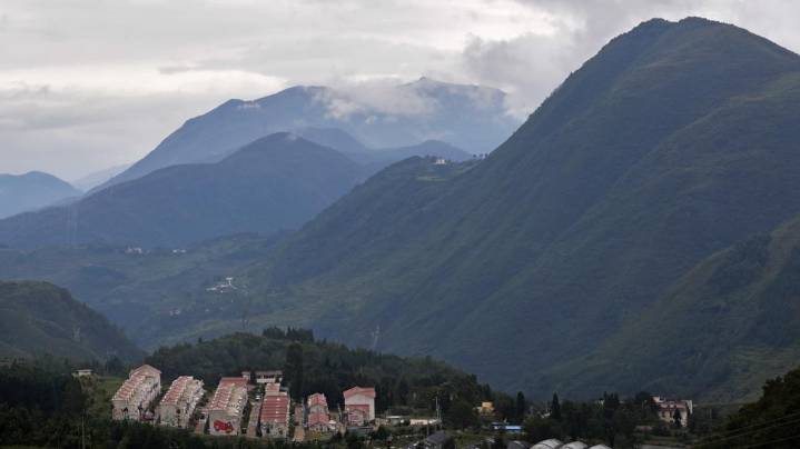 Bridge in China partially collapses after landslide