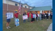 'It's time for action': Clay County teachers rally at board meeting, demanding pay raises