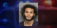 Lincoln man arrested after found with marijuana and rifle, police say