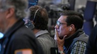 Wall St ends lower as banks warn of possible pullback