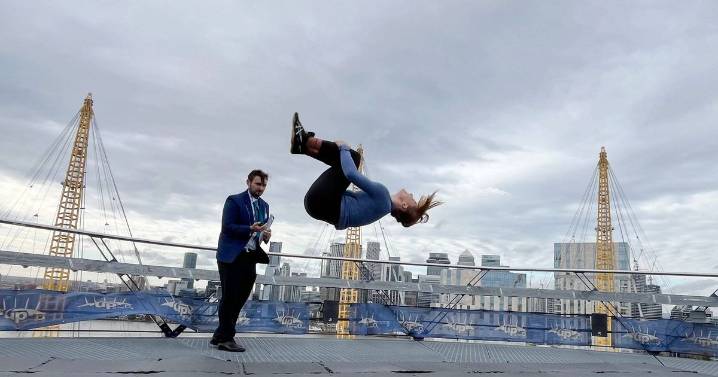 Former gymnast climbs to top of O2 Arena to break backflip world record