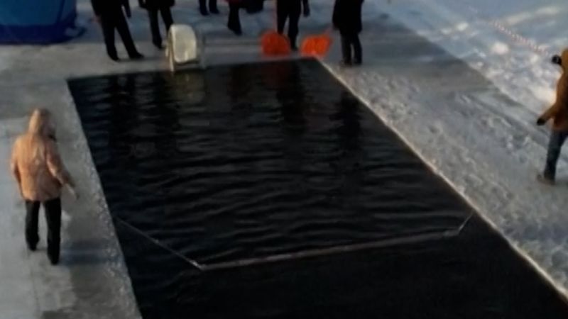 Swimmers brave the ice in Russia
