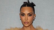 Kim Kardashian puts an autumn spin on the 'naked dress' in backless crochet look