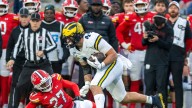 Michigan captain Max Bredeson in walking boot after injury vs Maryland