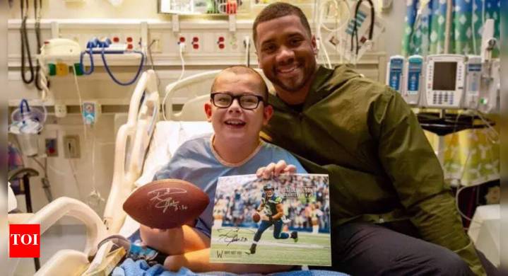 Russell Wilson's latest post captures a gentle moment with young patients, sparking heartfelt reactions online
