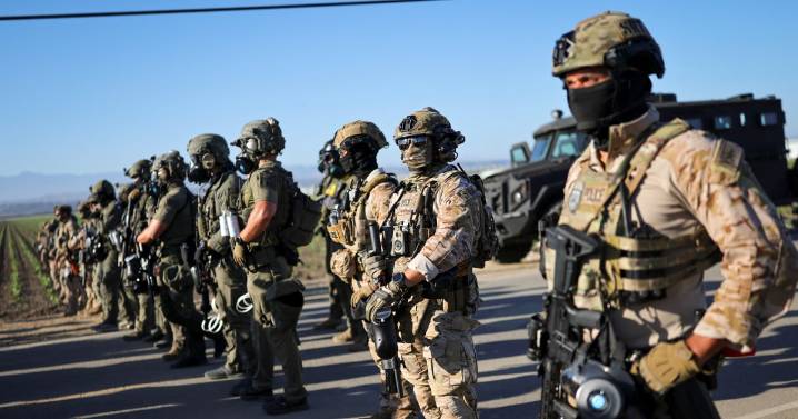 Trump administration sues California over law banning masked federal agents