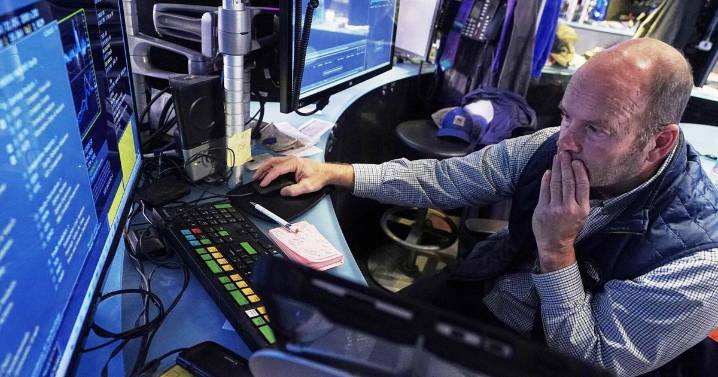 Dow falls by more than 800 points and tech stocks slide as traders dial back expectations for Fed rate cuts