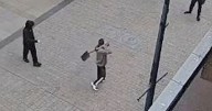 Video shows thug wielding a spade being dropped by member of the public