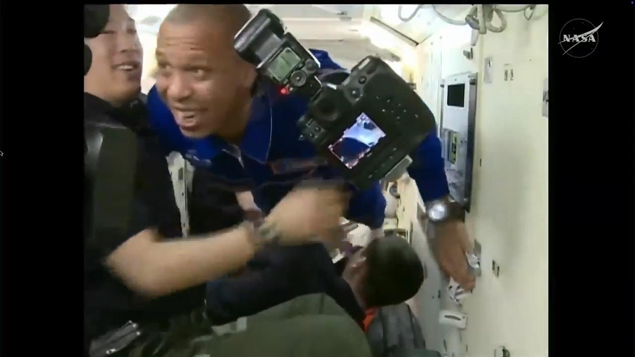 US-Russian crew aboard Soyuz spacecraft dock at International Space Station