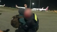 Jetstar passenger claims she was fleeing domestic violence when she stabbed AFP officers with pen